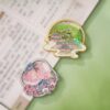 Collection of unique refrigerator magnets displaying Red Apricot & Swallows and Mountain Pavilion designs