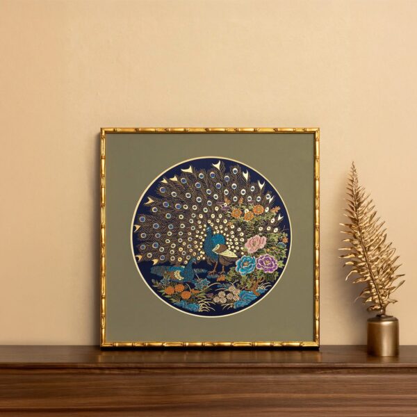 Nanjing Brocade peacock decorative artwork positioned upright on a table with a beige wall background