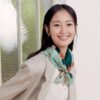 Woman wearing Wensli silk scarf