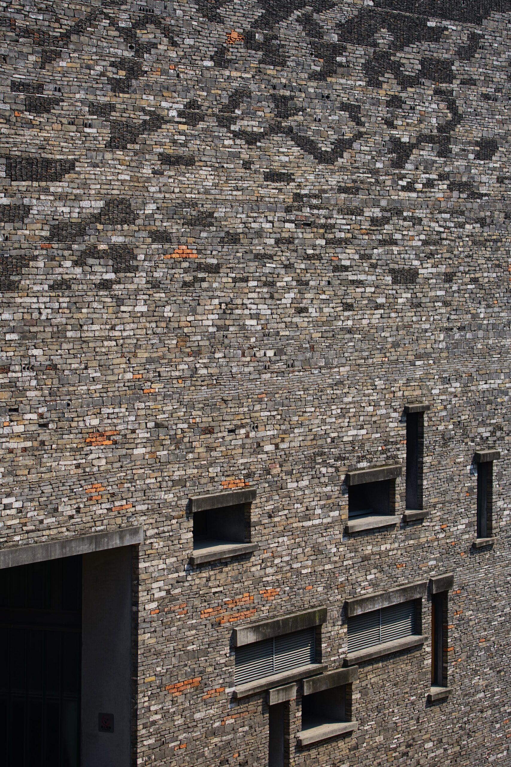 Breathable, naturally sourced materials carefully stacked to form the distinctive exterior of Wang Shu's Ningbo Historic Museum