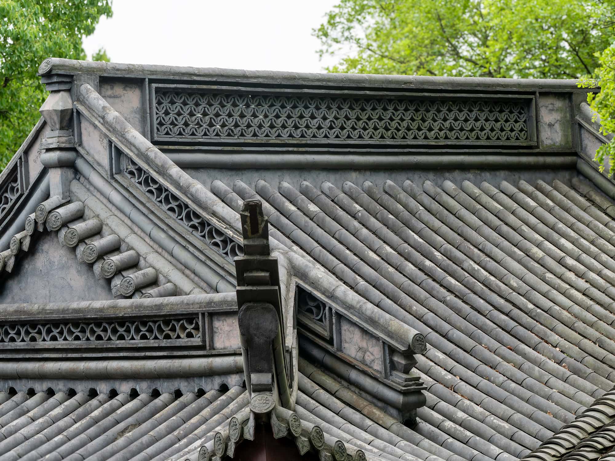Historic wooden roof showcasing intricate traditional joinery techniques outside the Baoguo Temple Ningbo