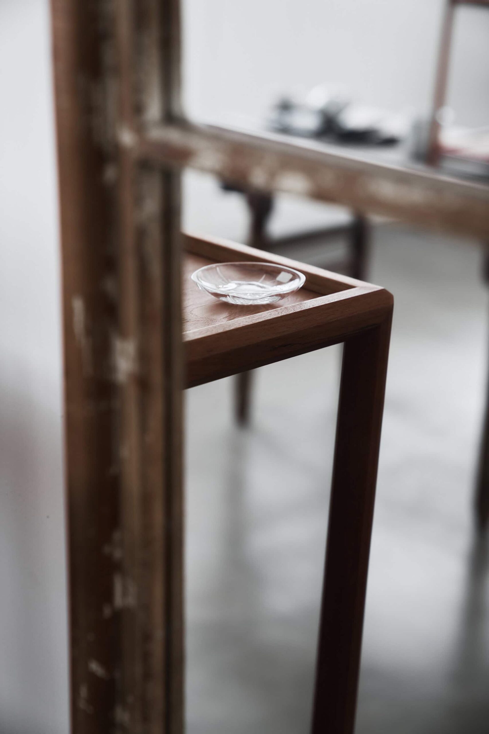 Vintage wooden furniture with transparent tea coaster at Soukai teaware shop in Ningbo