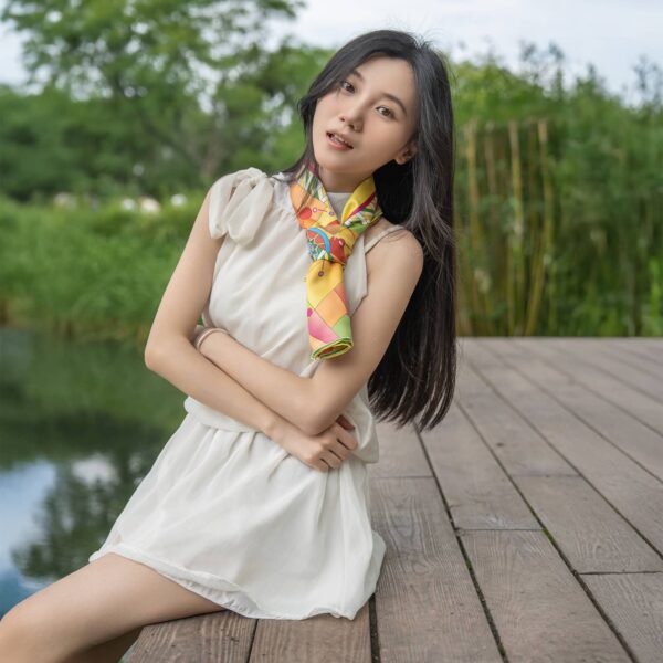 Fashion-forward portrait of a woman wearing the Aries-themed Wensli Silk Scarf
