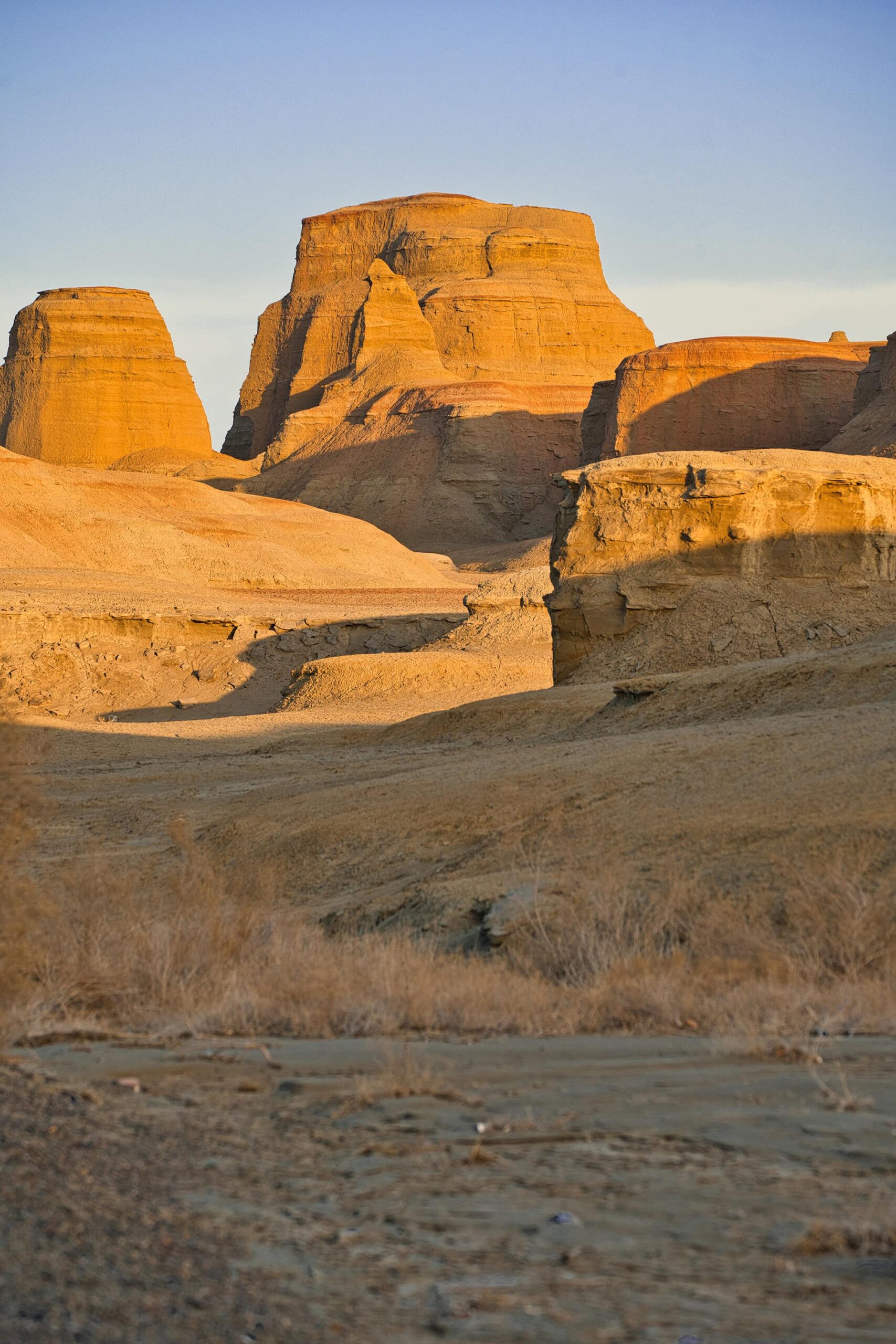 Sunlit Yardang landforms in Devil City Xinjiang, showcasing the striking sandstone formations of Karamay Ghost City