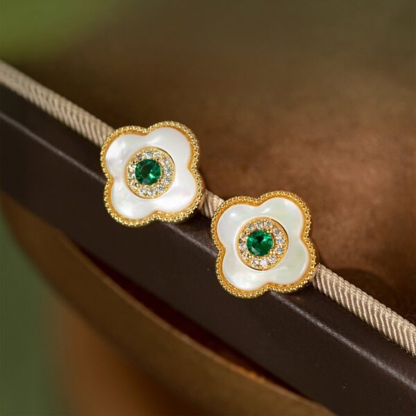 Close-up of Loulan Museum's lucky stud earrings in a four leaf clover shape