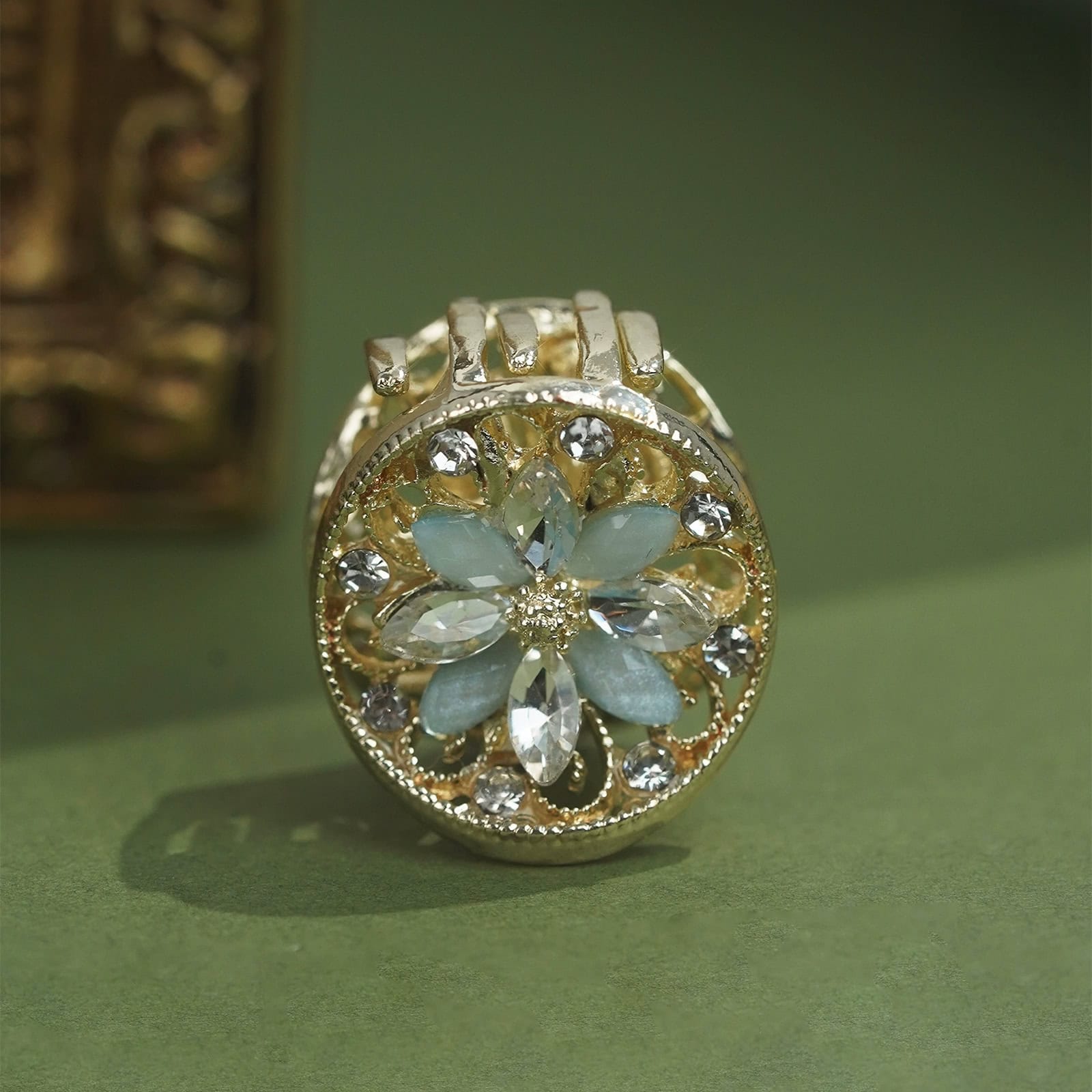 Close-up of an ornate Loulan relic-inspired claw clip