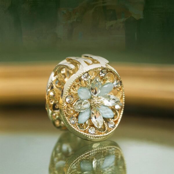 Elegant Loulan-inspired floral claw clip in antique gold, lotus-like openwork design