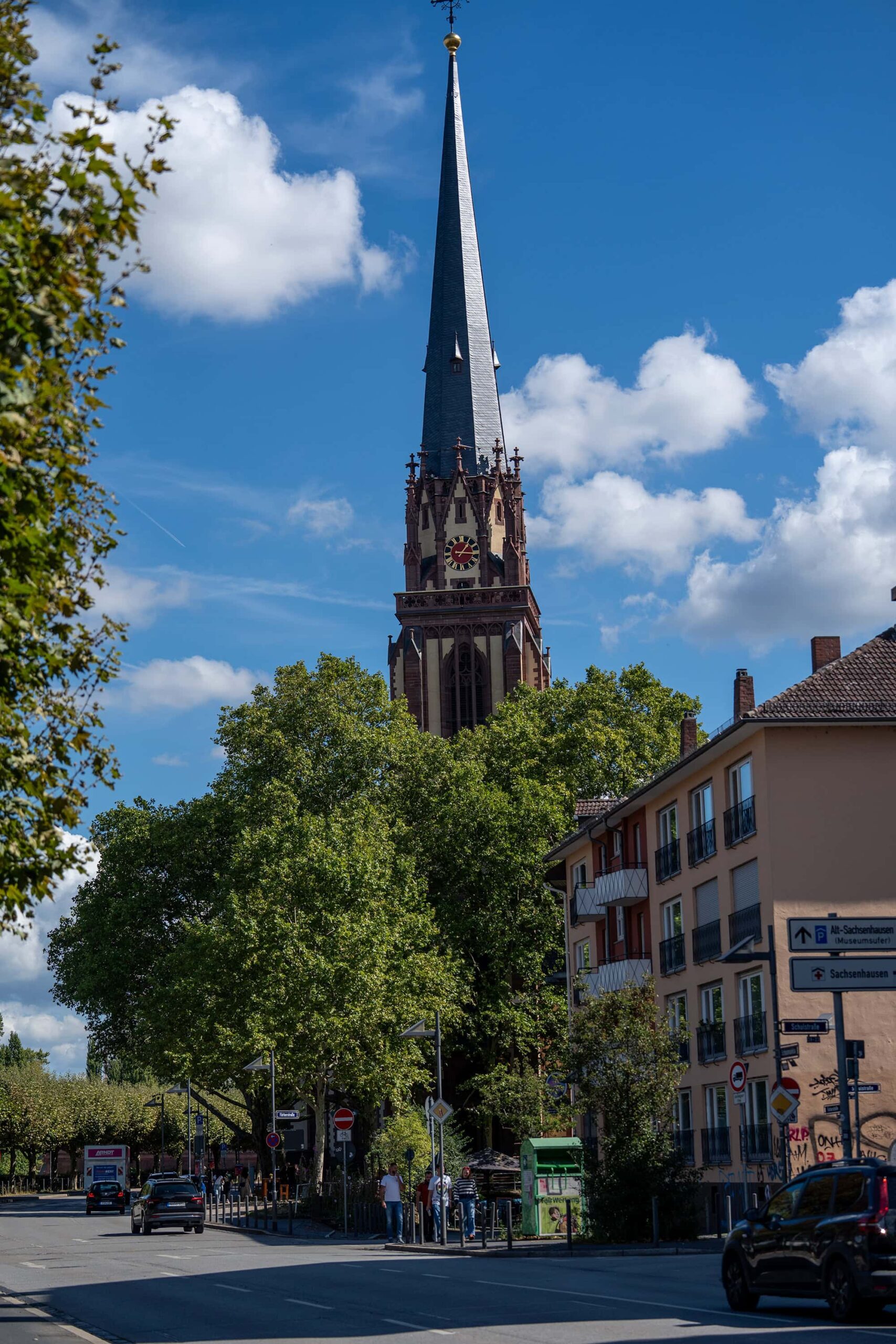 Dreikönigskirche (Church of the Three Kings) in Frankfurt under blue skies, captured from a local street