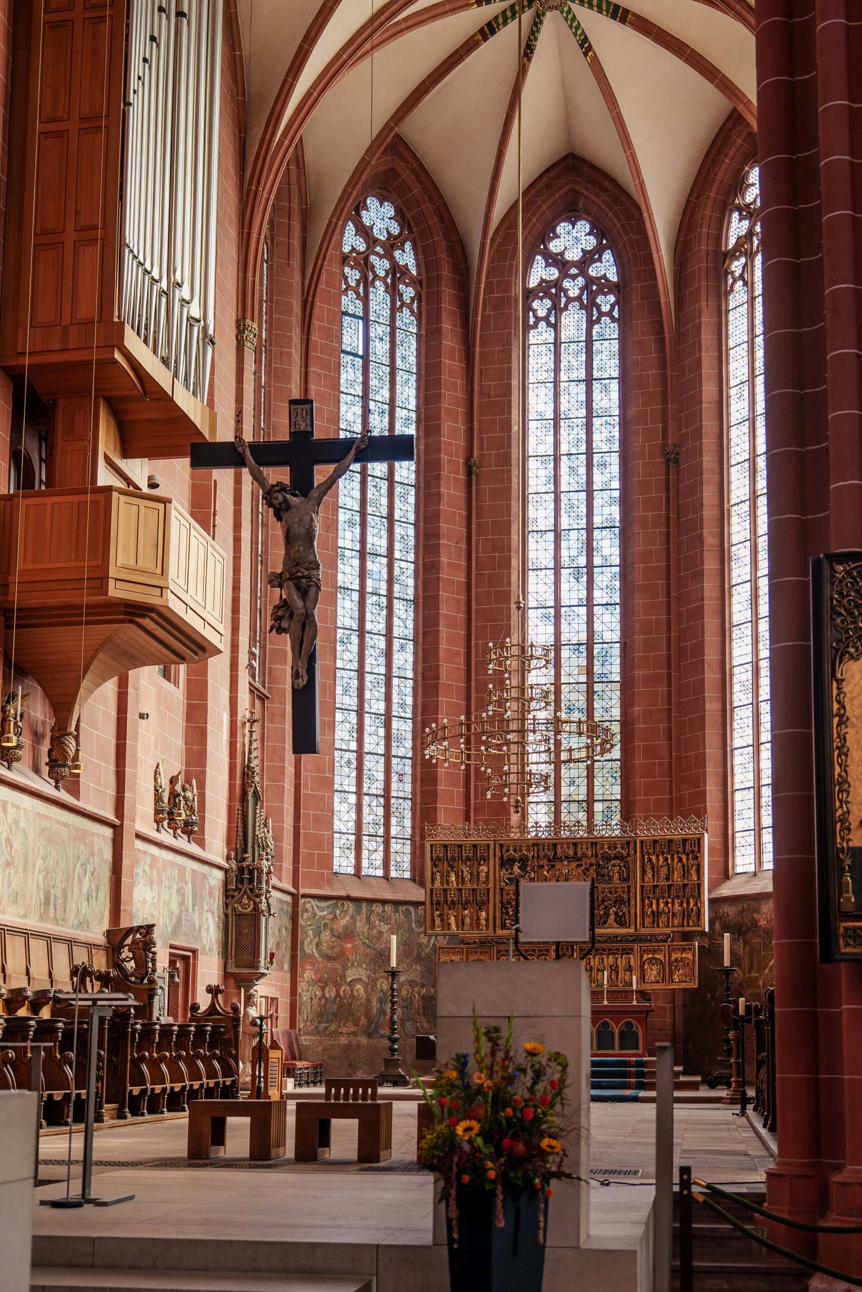 High altar and crucifix beneath vaulted ceilings in Frankfurt Cathedral
