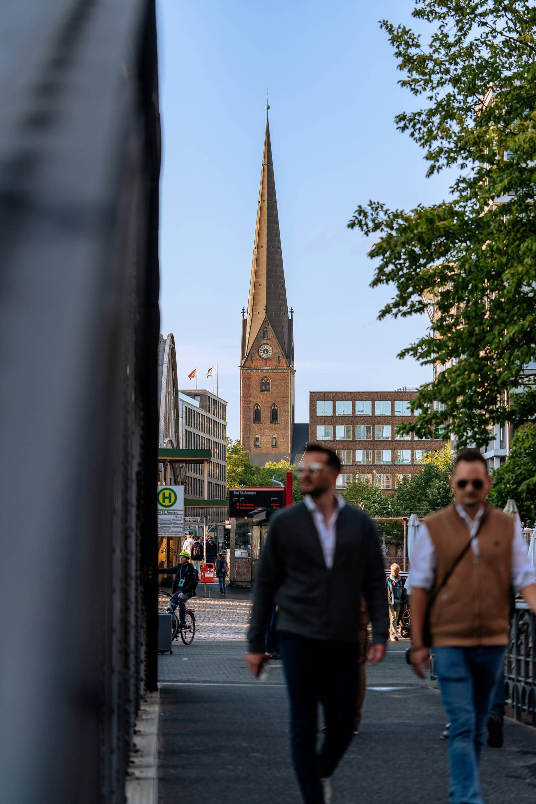People walking near St. Catherine’s Church in Hamburg, Germany