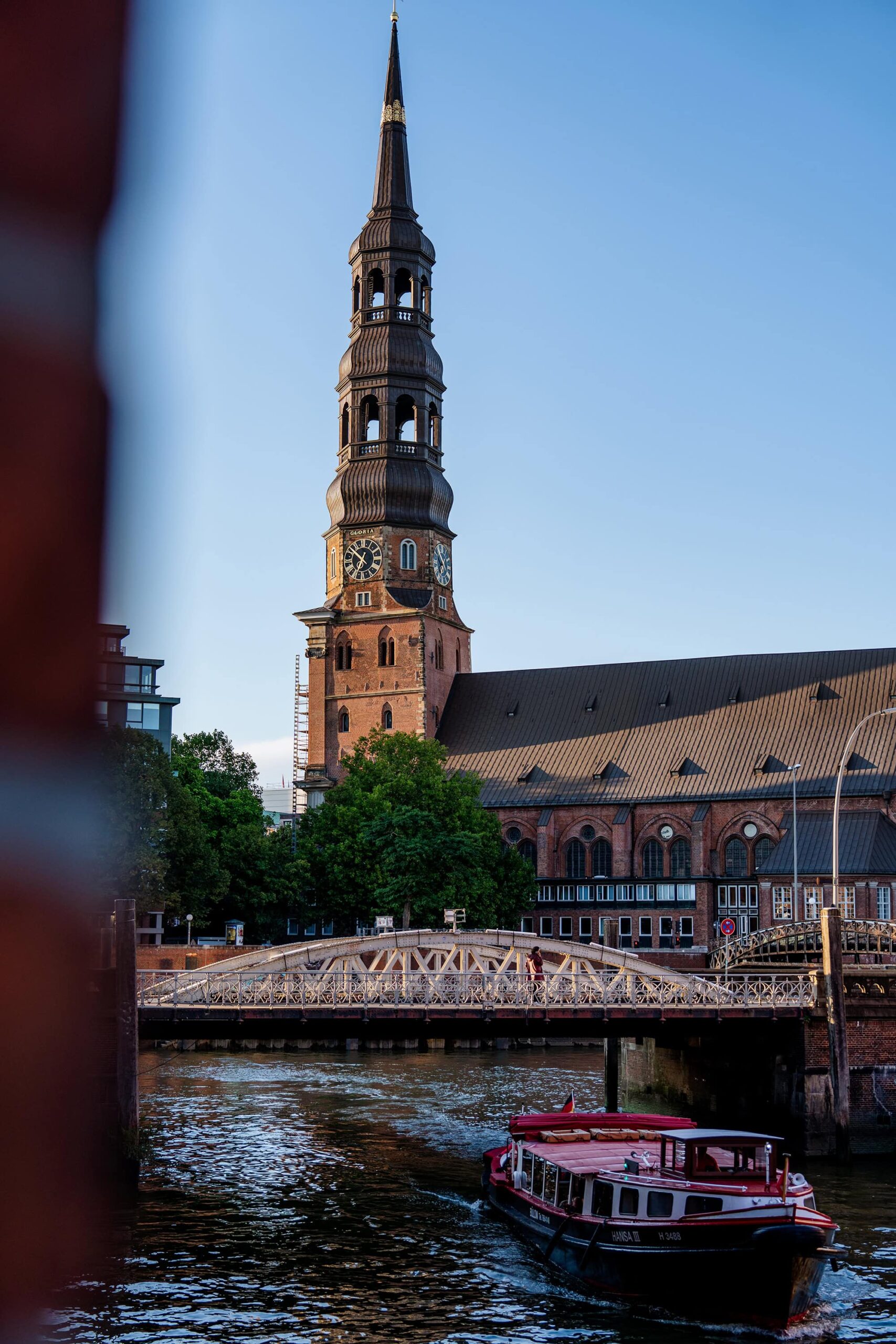 Scenic riverside view of St. Catherine’s Church, a historic landmark among top tourist attractions Hamburg visitors love to photograph