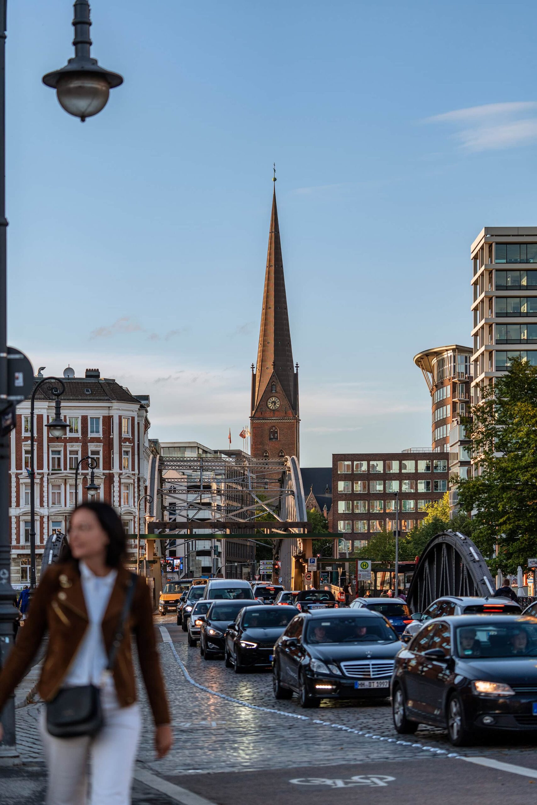 St Catherine Church seen beyond busy streets and late afternoon light