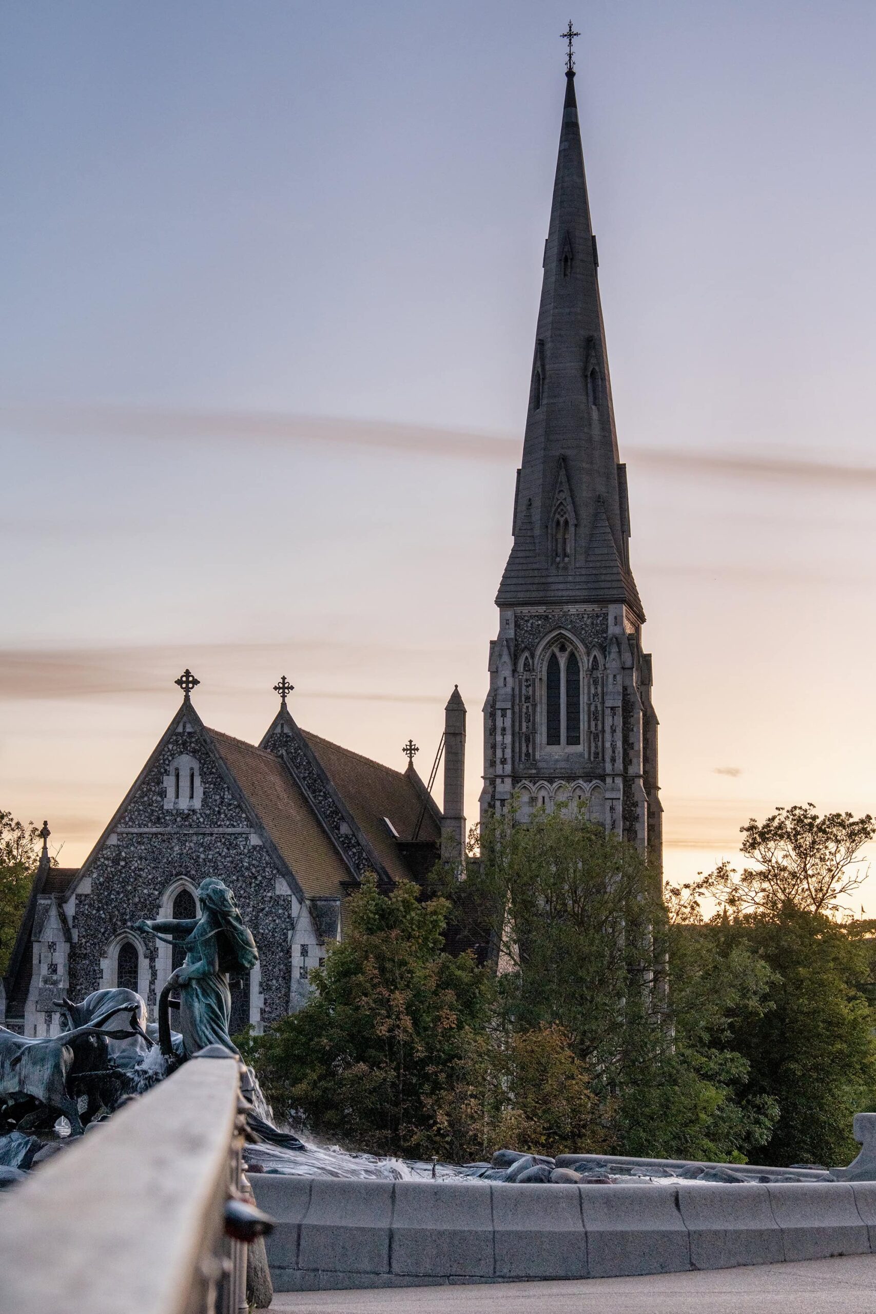 St. Alban’s Church and the Gefion Fountain in Copenhagen, a graceful blend of English Gothic architecture and mythic Danish sculpture