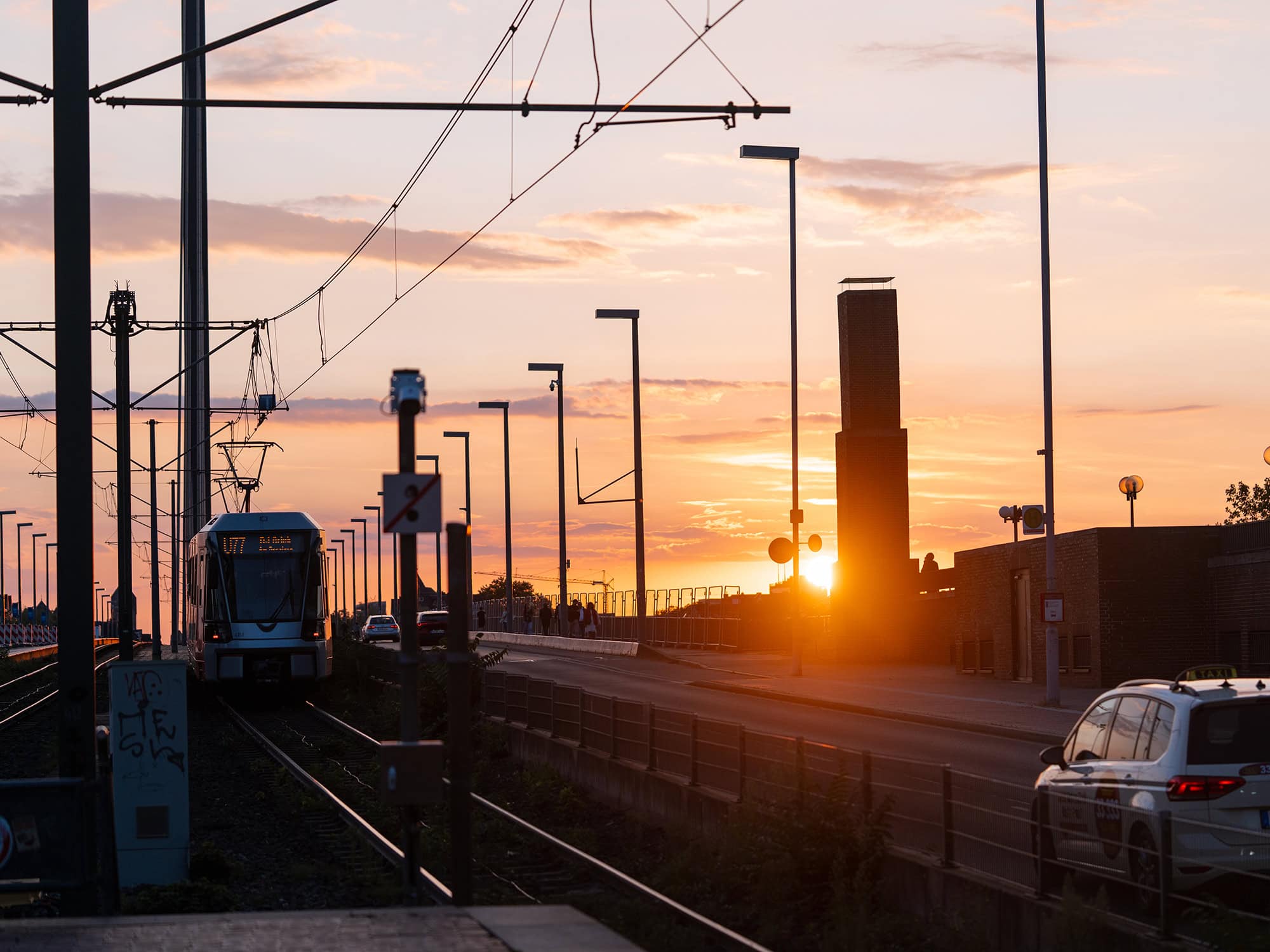 Sunset view from the Tonhalle:Ehrenhof tram line in Düsseldorf, with rails glowing under the fading light