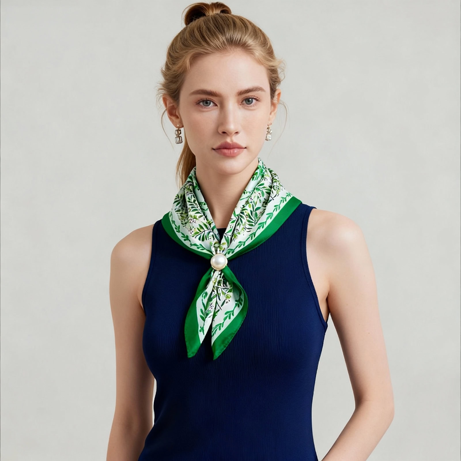 Model wearing Shanghai Story green silk scarf with floral print, tied elegantly around the neck