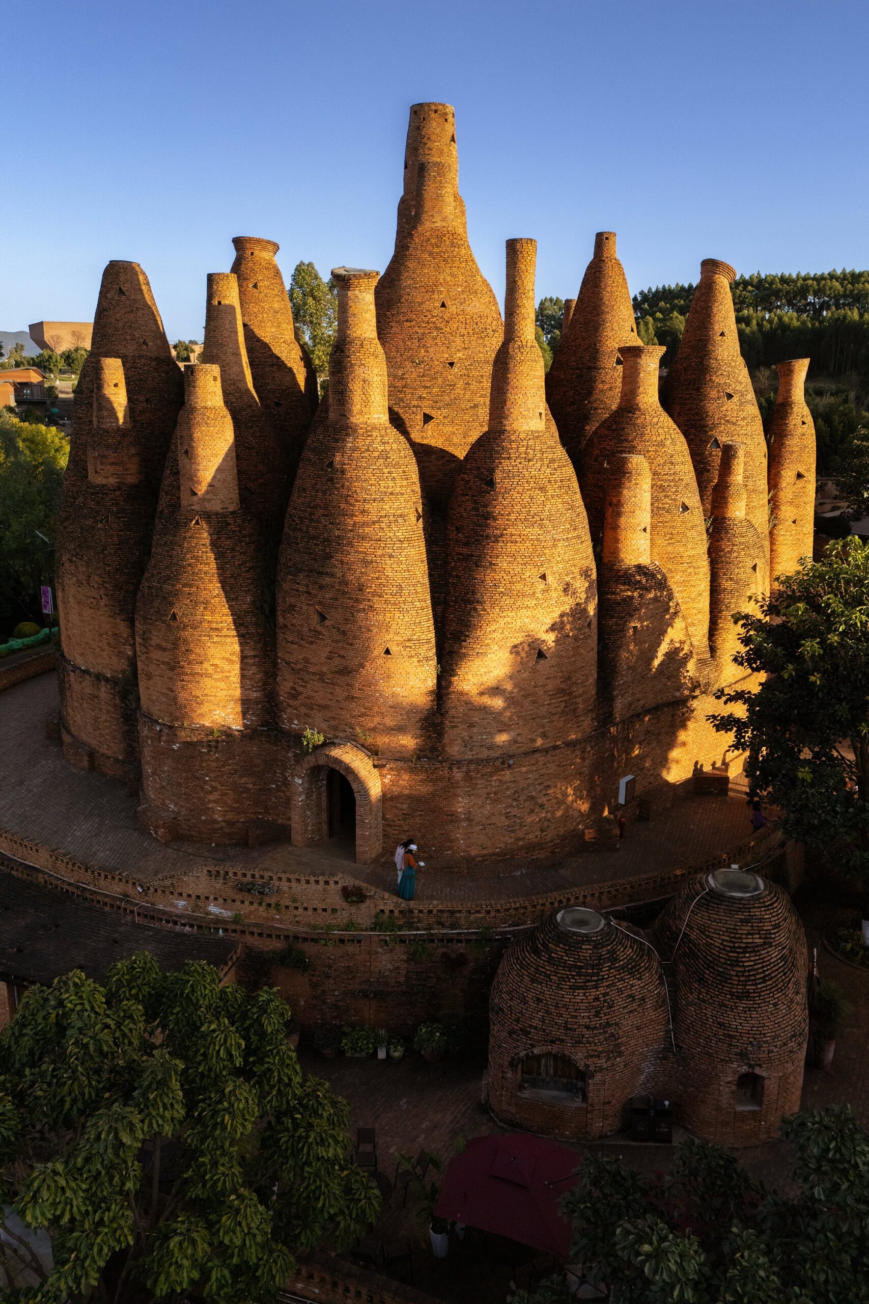 Kaleidoscope Art Museum at sunset in Dongfengyun Art Town, showing clustered red-brick cone towers in the Dongfengyun scenic area