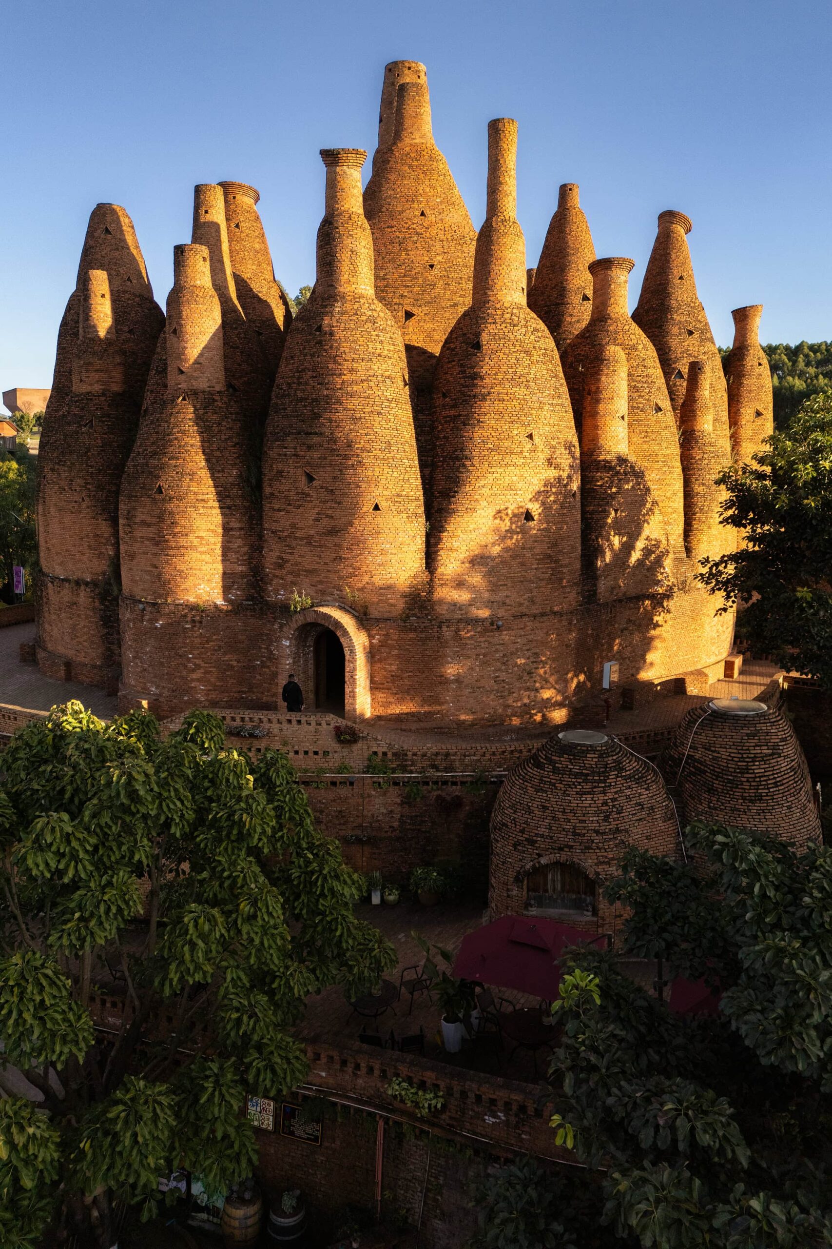 Warm evening light on the red-brick spires of the Kaleidoscope Art Museum, a landmark of Dongfengyun