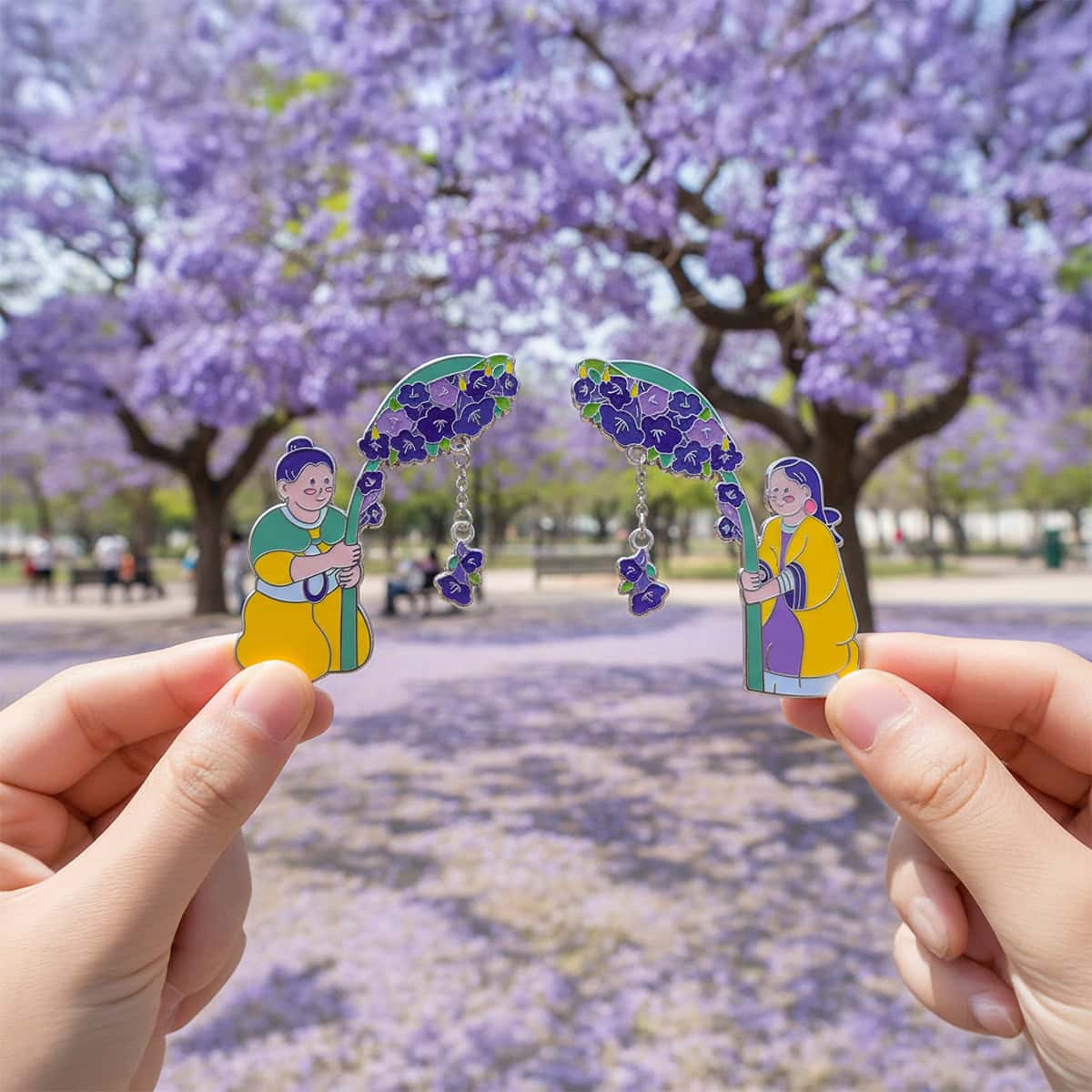 Hands holding the Yunnan Provincial Museum jacaranda flower fridge magnets outdoors with blooming purple jacaranda trees in the background