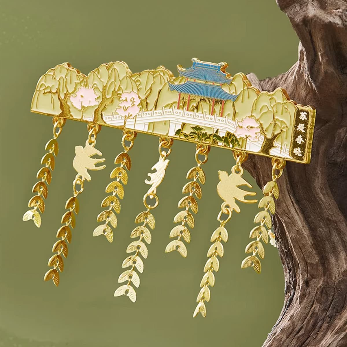 Hangzhou West Lake Su Causeway Dawn zinc alloy fridge magnet showing a white West Lake bridge, willow trees, peach blossoms, and a blue roof pavilion with dangling charms