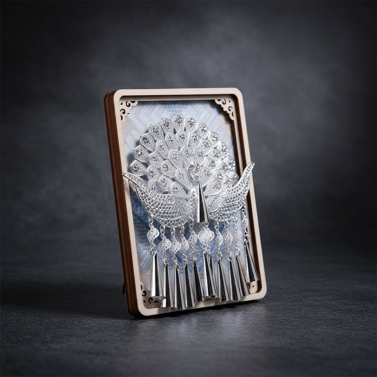 Jinping Queyu peacock fridge magnet with a peacock fanning its tail over a Zhuang brocade inspired backdrop, photographed upright on a dark studio background