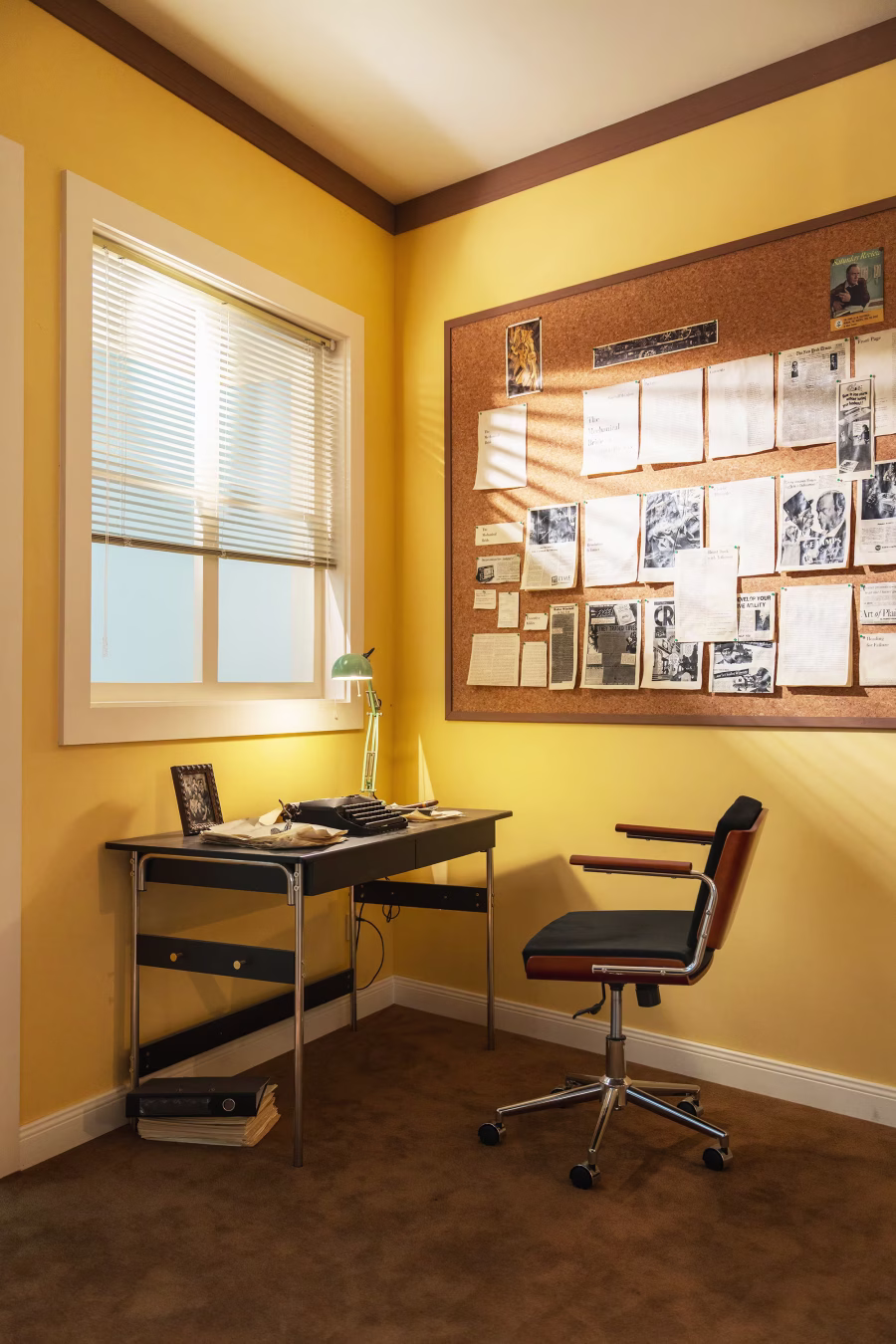 A reconstructed researcher's workspace at China Academy of Art Hangzhou, with a writing desk, chair, and a corkboard pinned with archival photographs and handwritten notes